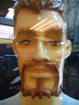 Many of the male mannequins have facial hair.  This one's painted, but often it's drawn on with markers.