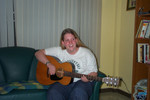 Angela playing her guitar
